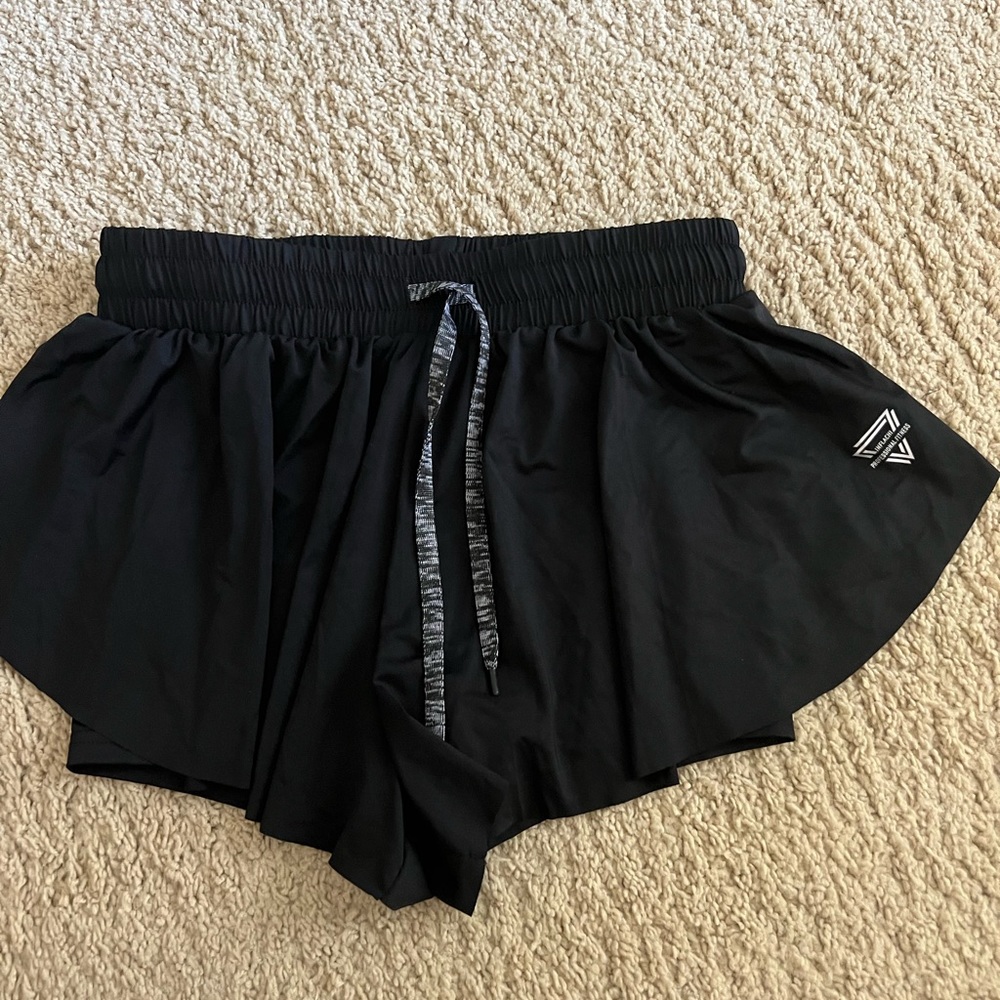 Never worn size medium black flutter athletic shorts